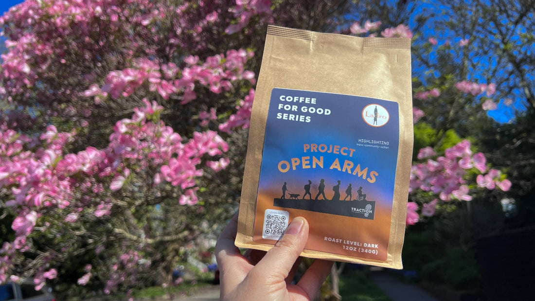 Coffe bag with Project Open Arms label with blooming dogwood tree in background